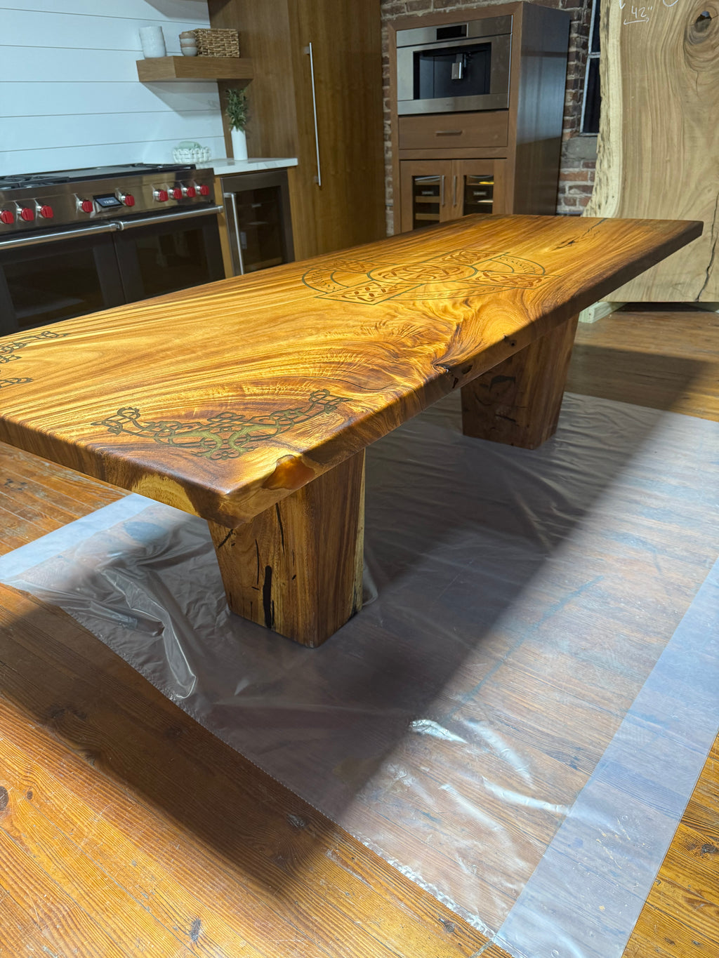 Custom Celtic Live edge Slab table with resin inlay and stiletto legs