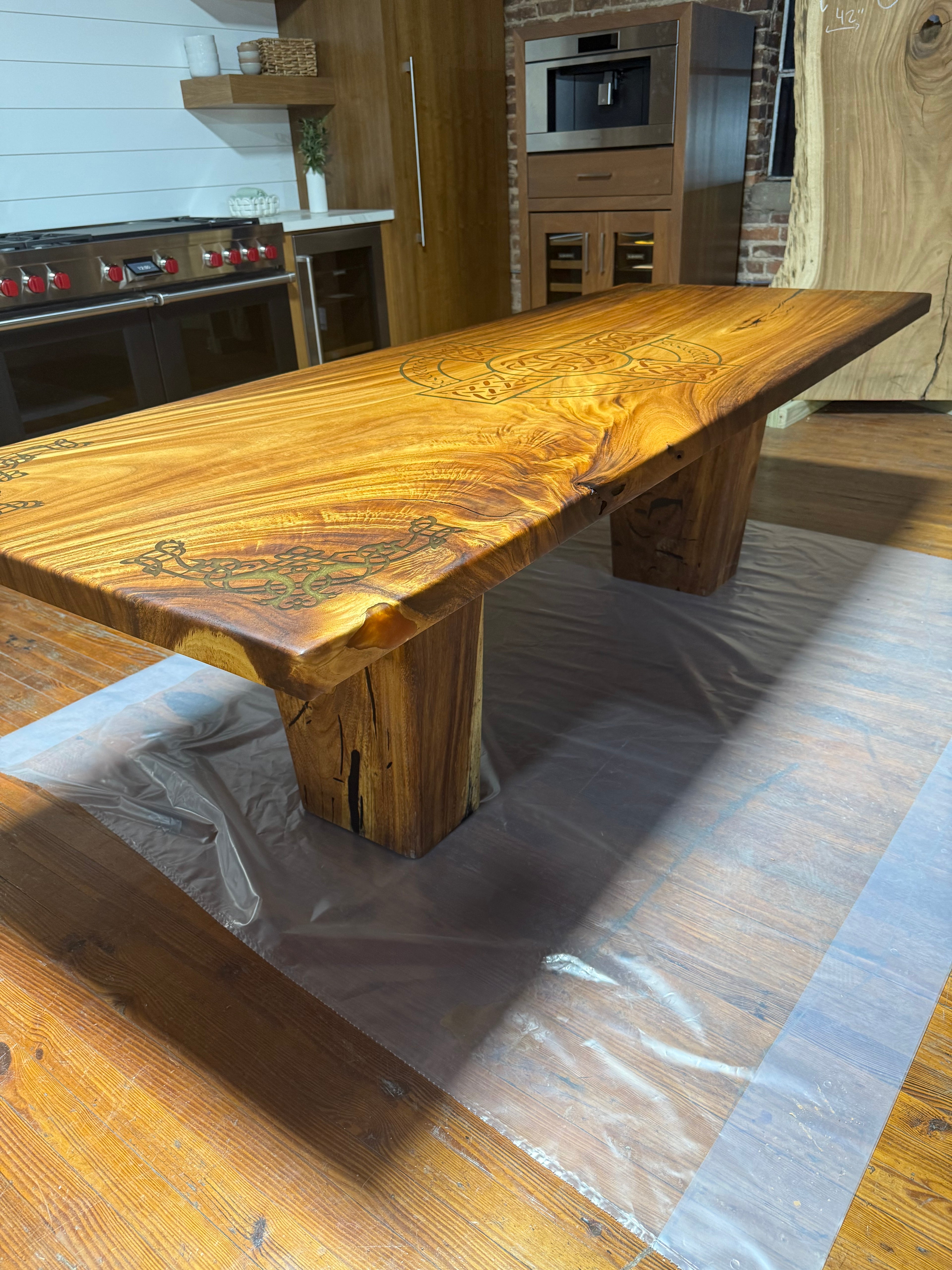 Custom Celtic Live edge Slab table with resin inlay and stiletto legs