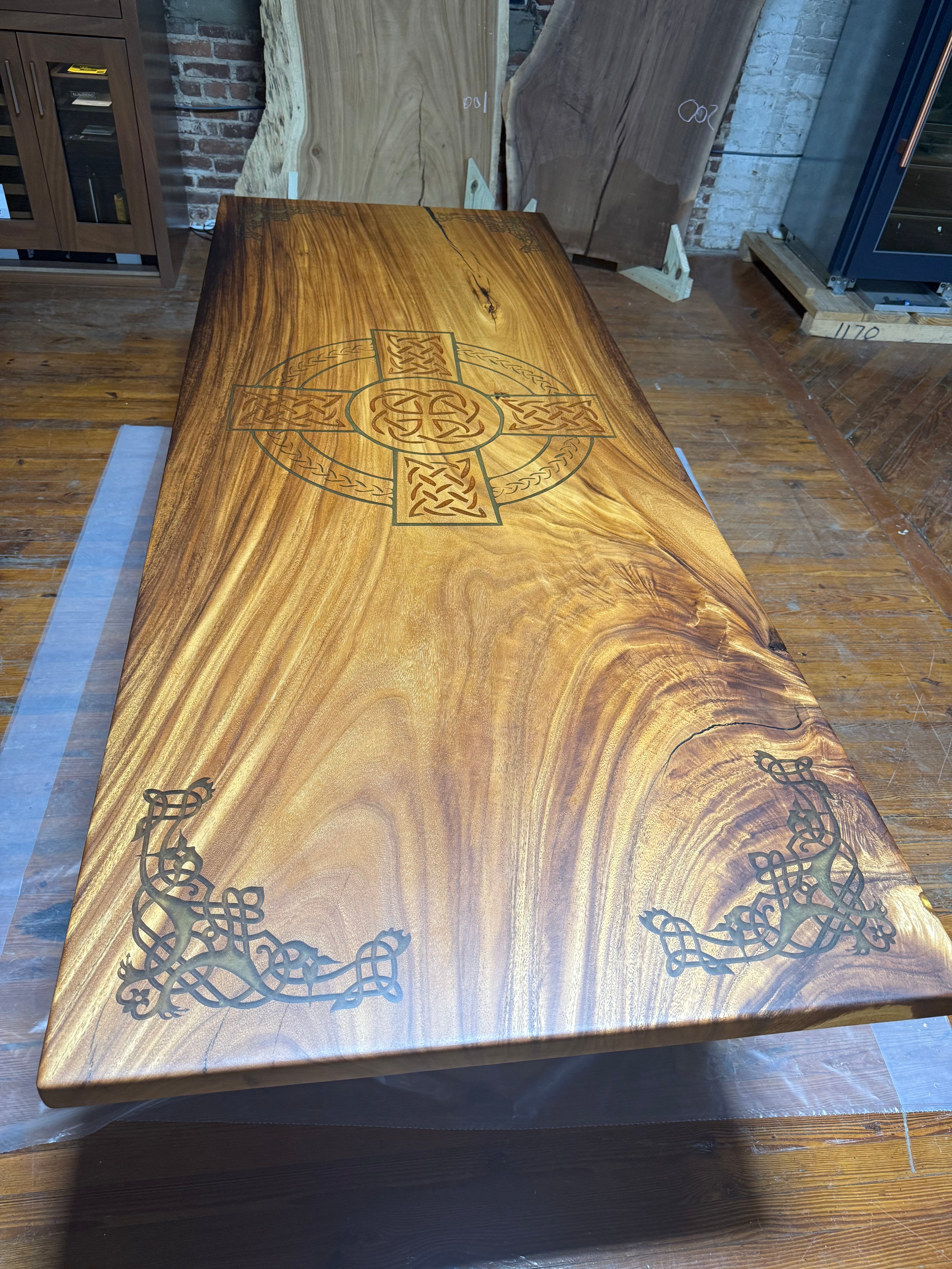 Custom Celtic Live edge Slab table with resin inlay and stiletto legs